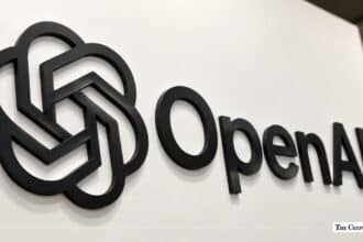 OpenAI corporate logo mounted on a white wall