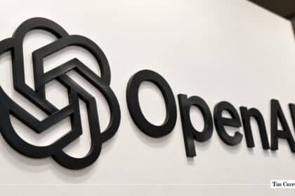 OpenAI corporate logo mounted on a white wall