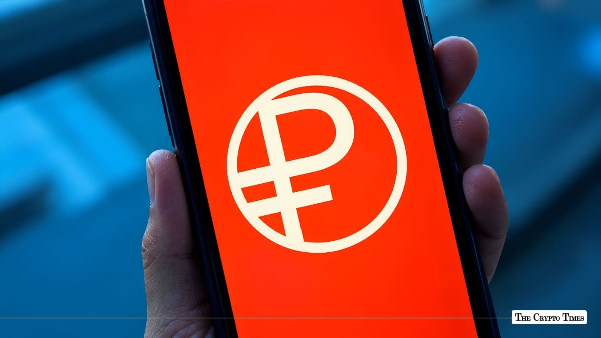 Smartphone displaying the digital Russian ruble symbol on a bright red screen.