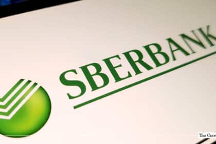 Green Sberbank logo and wordmark displayed on a white digital screen