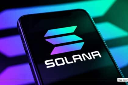 Smartphone screen displaying the gradient Solana (SOL) logo against a neon purple and green back-lit background