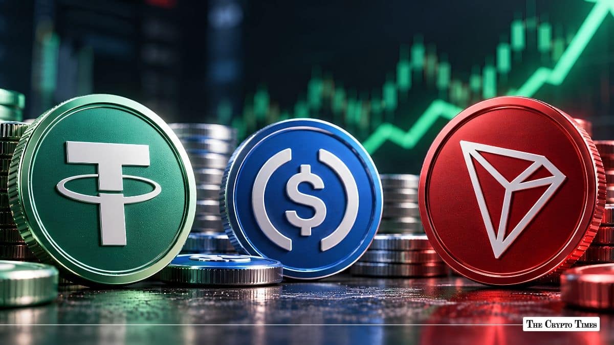 Tether, USD Coin, and TRON physical tokens displayed in front of a rising green financial chart.
