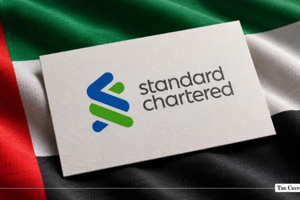 Standard Chartered logo card placed on a UAE flag