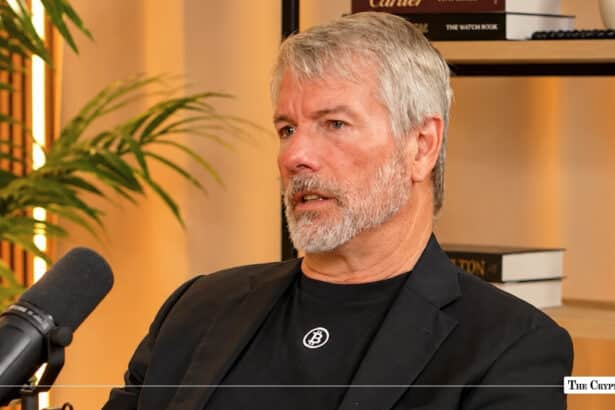 MicroStrategy's Michael Saylor wearing a Bitcoin shirt during a microphone interview