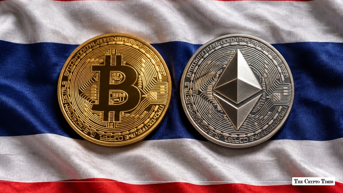 Physical gold Bitcoin and silver Ethereum coins lying on the national flag of Thailand