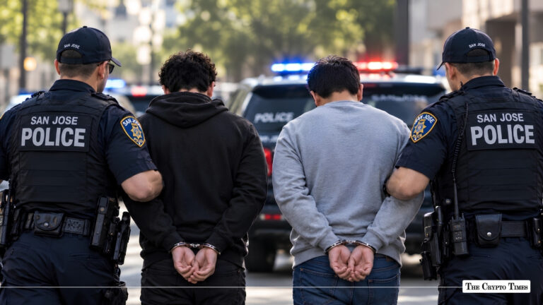 Two handcuffed suspects being escorted by San Jose police officers in front of a patrol vehicle.