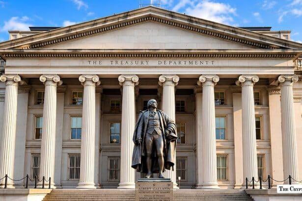 Exterior view of the U.S. Department of the Treasury building with the Albert Gallatin statue in front.