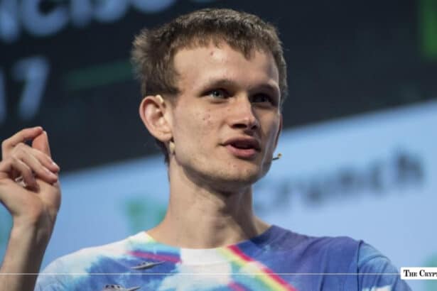 Vitalik Buterin, co-founder of Ethereum, speaking on stage in a tie-dye shirt while gesturing with his hand
