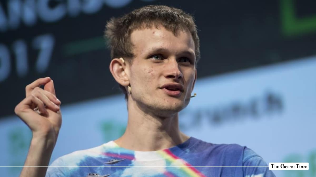 Vitalik Buterin, co-founder of Ethereum, speaking on stage in a tie-dye shirt while gesturing with his hand