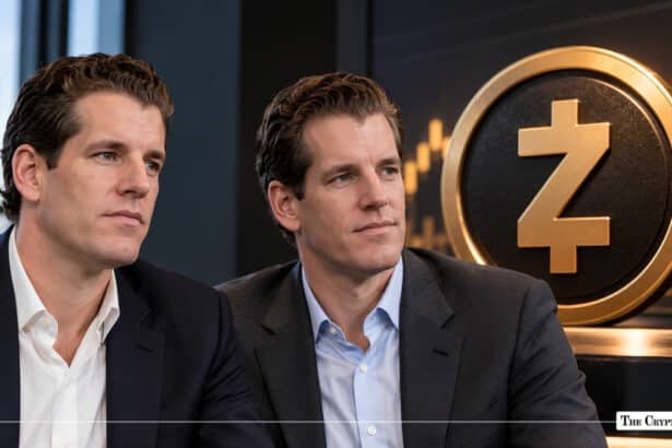 Tyler and Cameron Winklevoss seated in front of a large golden Zcash medallion.
