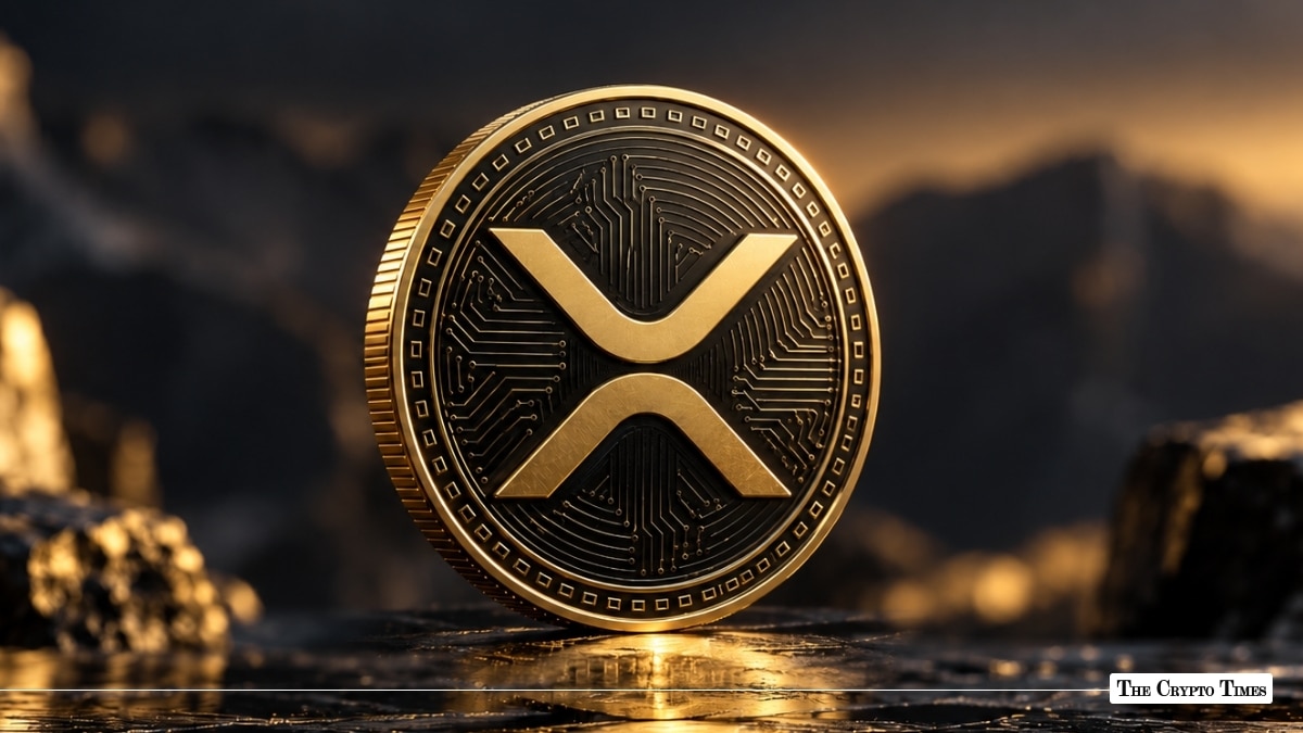 Physical gold XRP token standing on a dark reflective surface against a rugged landscape background